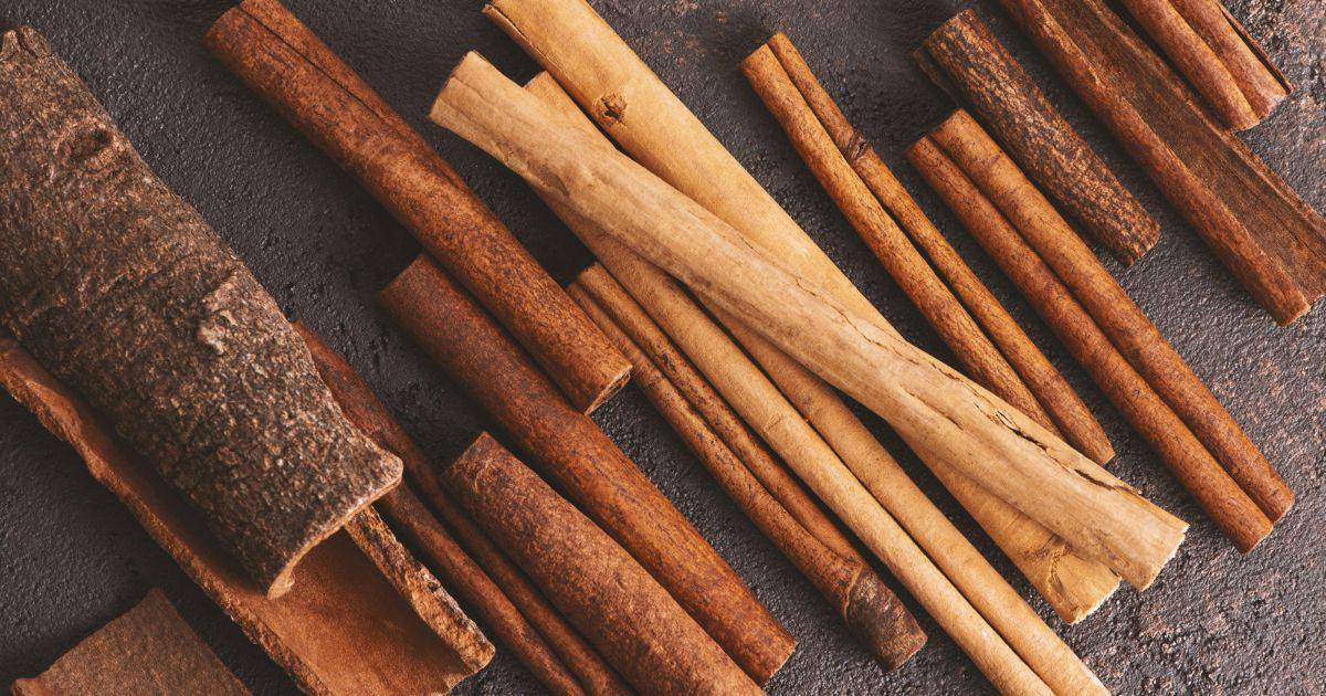 various styles of cinnamon sticks on a slate background